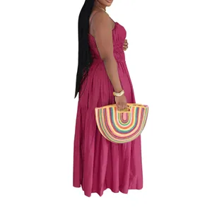 Side profile of a magenta bohemian sleeveless tiered maxi dress for summer wear