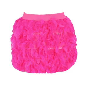Close-up of vibrant pink turkey feather mini skirt with fluffy texture for parties