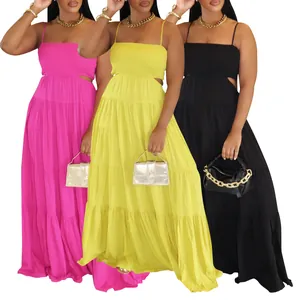Detail view of sleeveless tiered bohemian maxi dresses in pink, yellow and black.