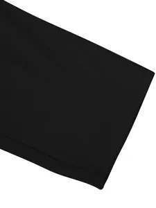 Detailed close-up showing neat stitching and linen fabric texture on black garment hem
