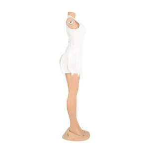 Side view of white tank top and fringe-trim shorts two-piece set on mannequin