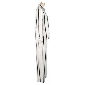 Detailed side profile of a stylish black and white vertical striped shirt and pants set