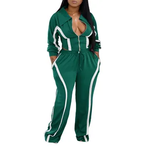 Women's green two-piece athletic tracksuit set with white stripes on white background