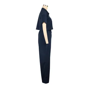 Side view of navy blue two-piece linen set with short-sleeve shirt and matching pants