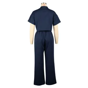 Back view of navy blue linen two-piece set with short sleeve top and wide leg pants