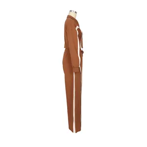 Side view of a brown two-piece cotton tracksuit featuring contrasting white side stripes