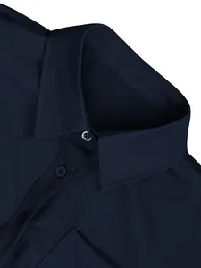 Close-up of navy blue shirt collar and buttons showing linen fabric texture.