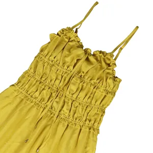 Close-up detail of yellow ruffled bodice on Bohemian camisole summer maxi dress