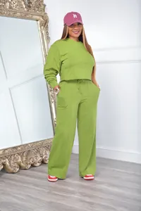 Detailed view of a stylish women's lime green two-piece sweatshirt and wide-leg tracksuit set