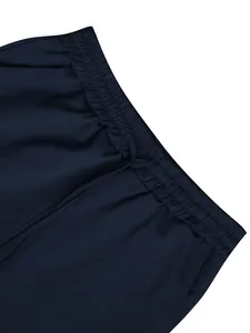 Detailed view of the elastic drawstring waistband on navy blue linen casual trousers