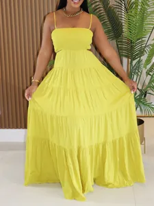 Detailed front view of vibrant yellow tiered bohemian maxi dress with cut-outs