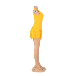 Side view of yellow two-piece summer set featuring a tank top and fringe trim shorts.