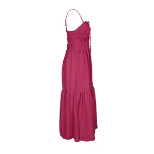 Side profile detail showing the layered tiered skirt and smocked elastic bodice of the dress