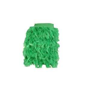 Close-up detail of the vibrant green turkey feather layers on this party mini skirt