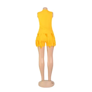 Back view of a vibrant yellow two-piece summer set featuring a vest and fringed shorts.