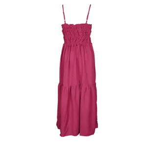 Detailed view of bohemian tiered pink maxi dress with smocked bodice and adjustable straps