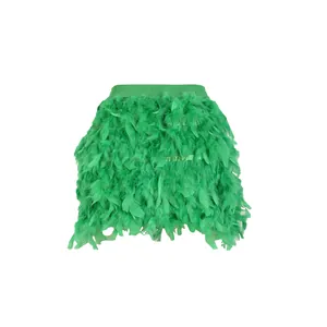 Close-up detail of a vibrant green turkey feather mini skirt designed for party wear