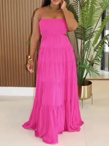 Detail view of pink bohemian tiered maxi dress with smocked bodice and spaghetti straps