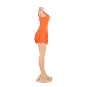 Side view of orange two-piece set with sleeveless tank top and fringe trim shorts