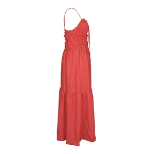 Side view of red Bohemian tiered maxi dress with ruffled smocked bodice details
