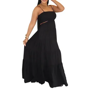 Side profile of a black bohemian tiered maxi dress featuring cutout waist detail