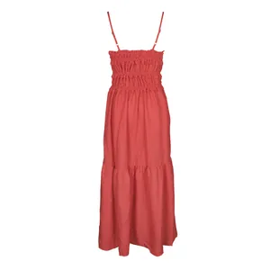 Elegant Bohemian red maxi dress with spaghetti straps, smocked bodice, and tiered skirt