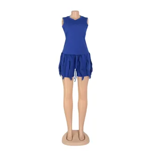 Chic blue two-piece summer outfit featuring sleeveless top and fringe trim shorts.