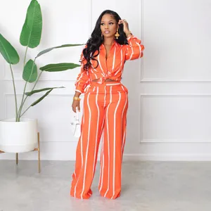 Stylish orange and white striped two-piece shirt and wide-leg pants set for women