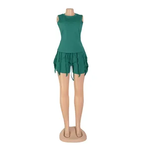 Detail view of women's green two-piece set with fringe sleeveless top and shorts