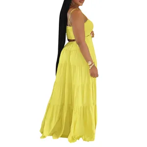 Side view of a bright yellow Bohemian tiered maxi dress with strappy bodice