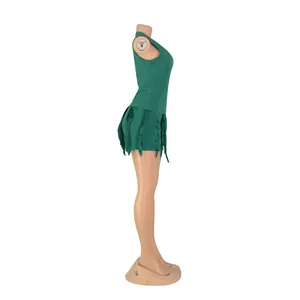 Side view of green two-piece set featuring fringe trim on shorts and sleeveless top.