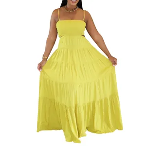 Detailed view of yellow tiered bohemian maxi dress with smocked bodice and thin straps