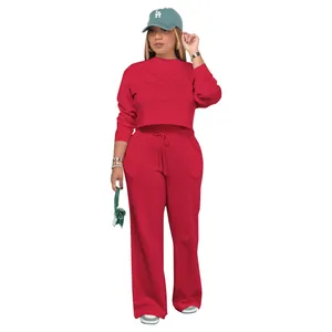 Detailed view of a red two-piece casual tracksuit for women including sweatshirt and pants