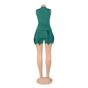 Back view detail of green two-piece set featuring fringe tassels on the sleeveless shorts.