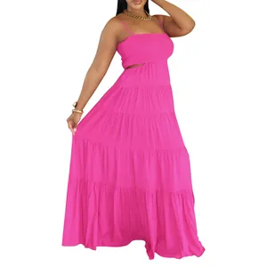 Detailed view of hot pink bohemian tiered maxi dress showing flowy summer style
