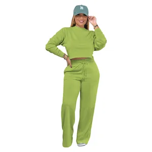 Lime green two-piece sweatshirt set featuring cropped top and wide-leg pants for women