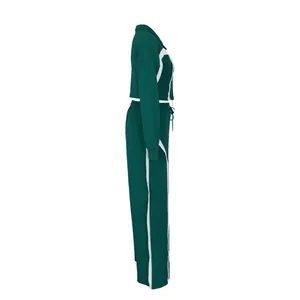 Side view of professional green two-piece athletic tracksuit set with white stripes