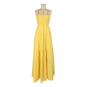 Vibrant yellow bohemian tiered maxi dress with thin straps and smocked bodice detail.