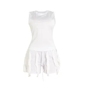 White two-piece summer set with sleeveless tank top and fringe trim shorts for women