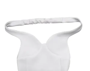 Close-up detail of elegant white mini dress with sexy V-neck and elastic halter strap