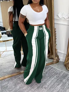 Pantalon décontracté vert à jambes larges avec bandes blanches et taille élastique