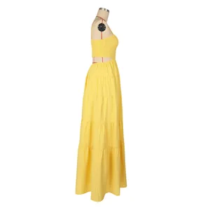 Detailed side view of yellow bohemian tiered maxi dress with elegant cutout design