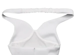 Close-up detail of white cocktail dress back featuring elastic strap and zipper