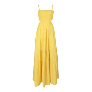 Detail of yellow tiered maxi dress featuring smocked bodice and waist cut-outs