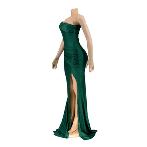 Detailed side view of elegant dark green off-shoulder evening gown with high slit