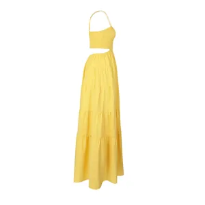 Side view of yellow bohemian tiered maxi dress with cutout waist and smocked bodice