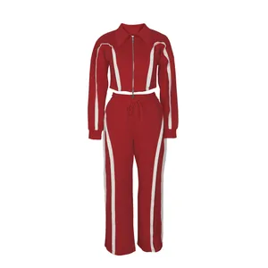 Detail showing the full cut and contrast white stripe patterns on the red sports set