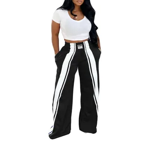 Vue détaillée du pantalon large décontracté pour femme avec des bandes blanches sur le côté