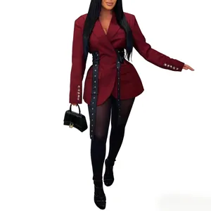 Detailed view of a burgundy women's blazer with side waist-tie belts and metallic buttons