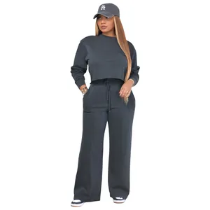 Full length view of a women's charcoal two-piece sweatshirt and wide-leg jogger set